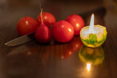 Cooking by candlelight. No electricity due to war in Ukraine clipart