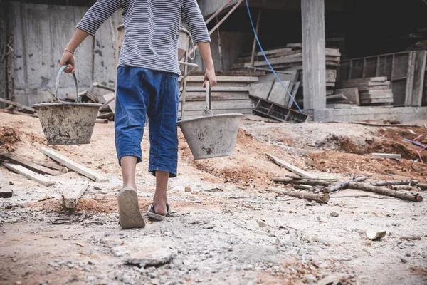 stock image boys labor work in the construction site,  Against child labor, Poor children,  construction work, Violence children and trafficking concept