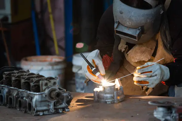 Welder is welding Tungsten Inert Gas welding, Welding aluminum with aluminum argon, TIG welding torch.