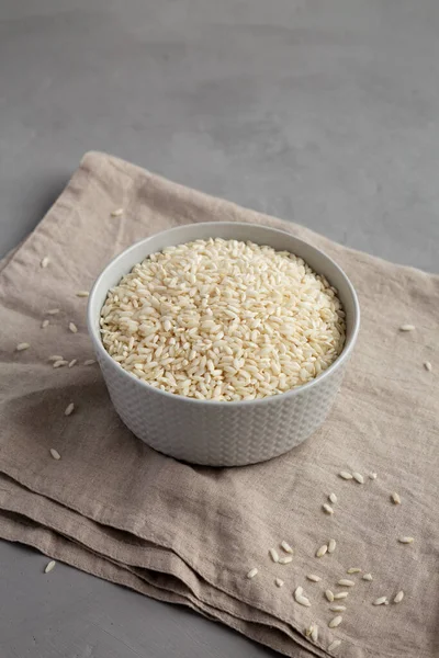Raw Organic Carnaroli Rice Bowl Gray Surface Side View — Stock Photo, Image