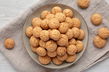 Homemade Italian Amaretti Cookie Biscuits on a Plate, top view. From above, overhead, flat lay.