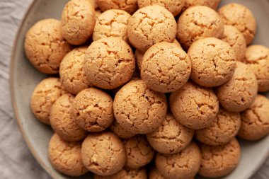 Homemade Italian Amaretti Cookie Biscuits on a Plate, top view. From above, overhead, flat lay. Close-up.