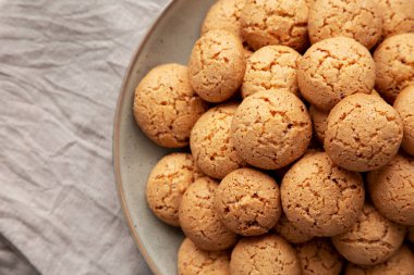 Homemade Italian Amaretti Cookie Biscuits on a Plate, top view. From above, overhead, flat lay. Copy space.