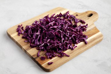 Shredded Purple Cabbage on a Board, low angle view.
