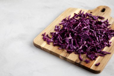 Shredded Purple Cabbage on a Board, low angle view. Copy space.