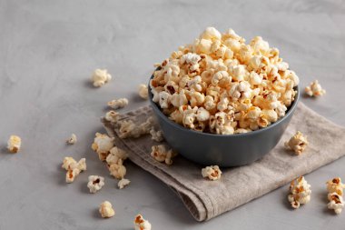 Homemade Kettle Corn Popcorn with Salt in a Bowl, side view. 