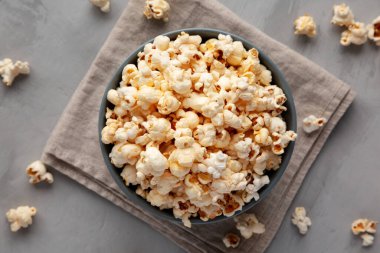 Homemade Kettle Corn Popcorn with Salt in a Bowl, top view. Flat lay, overhead, from above. 