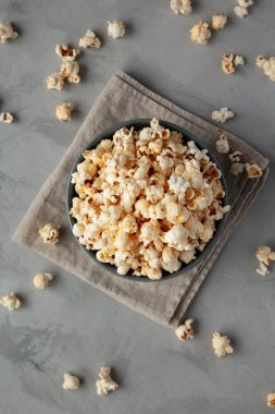 Homemade Kettle Corn Popcorn with Salt in a Bowl, top view. Flat lay, overhead, from above. 