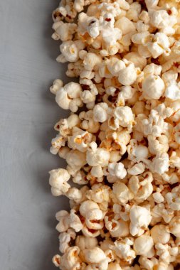 Homemade Kettle Corn Popcorn with Salt in a Bowl, top view. Flat lay, overhead, from above. Copy space.