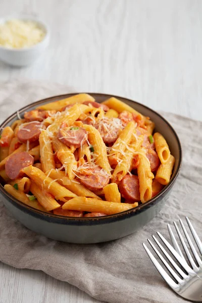 Homemade One-pot Hot Dog Pasta in a Bowl, side view. Space for text.