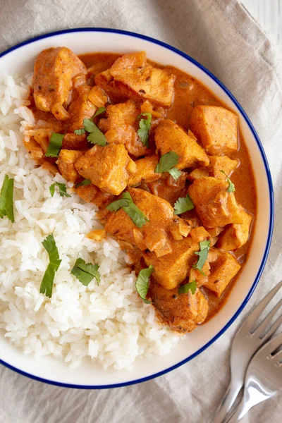 stock image Homemade Easy Indian Butter Chicken with Rice on a Plate, top view. Flat lay, overhead, from above. 