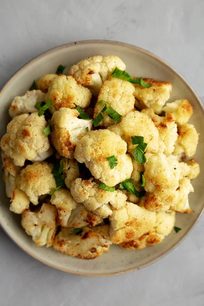 stock image Homemade Roasted White Cauliflower on a Plate, top view. Flat lay, overhead, from above. Close-up.