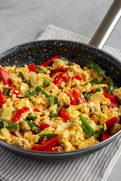 stock image Homemade Scrambled Peppers and Eggs in a Pan, side view.