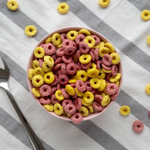 Colorful Cereal Loops with Whole Milk for Breakfast. Flat lay, overhead, from above.
