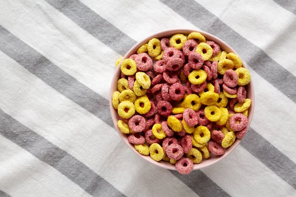 Colorful Cereal Loops with Whole Milk for Breakfast. Flat lay, overhead, from above. Copy space.