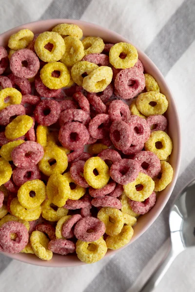 Colorful Cereal Loops with Whole Milk for Breakfast. Flat lay, overhead, from above. Close-up.