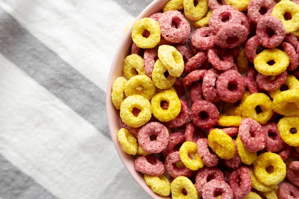 Colorful Cereal Loops with Whole Milk for Breakfast. Flat lay, overhead, from above. Copy space.