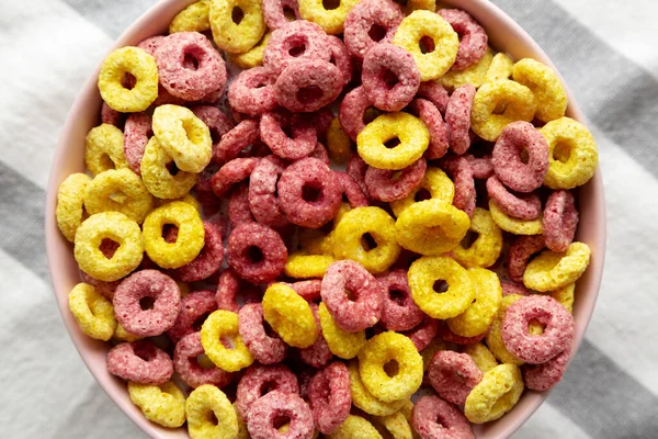 Colorful Cereal Loops with Whole Milk for Breakfast. Flat lay, overhead, from above. Close-up.