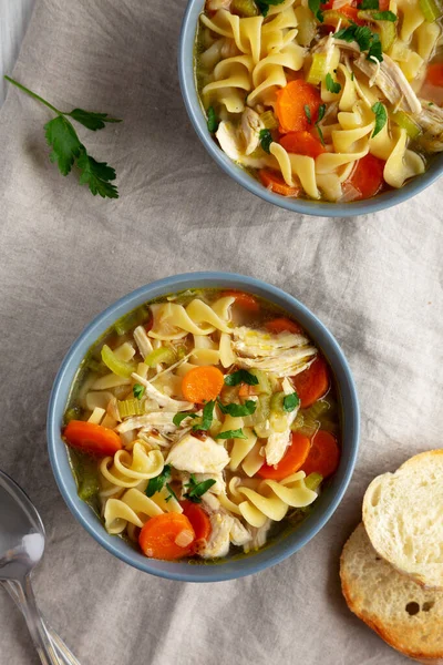 Stock image Homemade Chicken Noodle Soup in a Bowl, top view. Flat lay, overhead, from above.