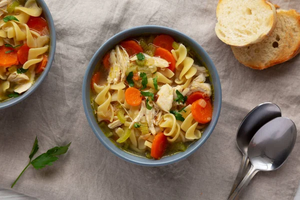 stock image Homemade Chicken Noodle Soup in a Bowl, top view. Flat lay, overhead, from above.