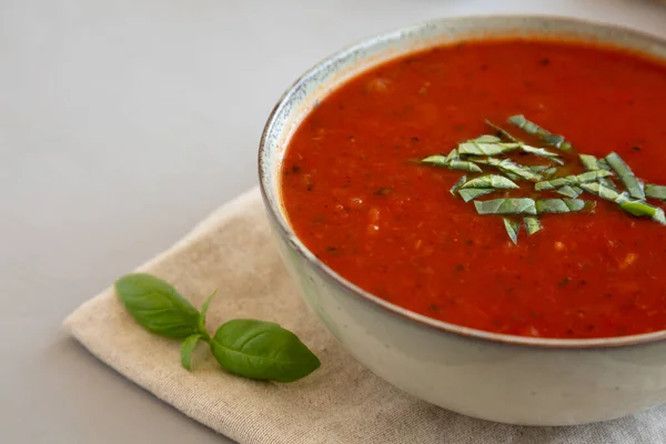 stock image Homemade Tomato Basil Soup in a Bowl, low angle view. Close-up. Copy space.