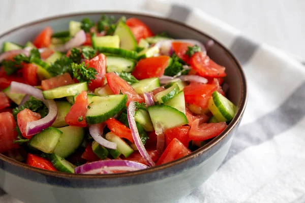 stock image Homemade Mediterranean Cucumber Tomato Salad in a Bowl, side view. Close-up.