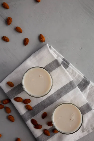 Organic White Almond Milk in Glasses, top view. Copy space.