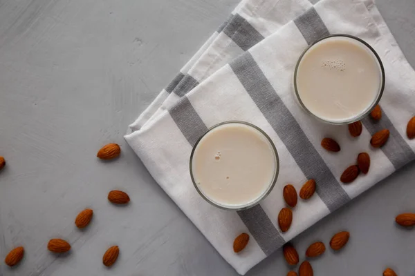 Organic White Almond Milk in Glasses, top view. Copy space.