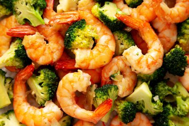 Homemade Garlic Broccoli Shrimp Stir Fry on a Plate, top view. Flat lay, overhead, from above. Close-up. clipart