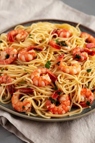 Homemade Cooked Garlic Shrimp Scampi on a Plate, side view.