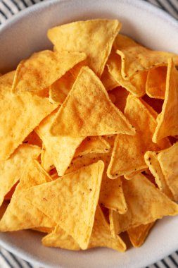 Ev yapımı Cheese Tortilla Chips in a Bowl, top view. Dümdüz, tepeden, yukarıdan. Yakın plan..