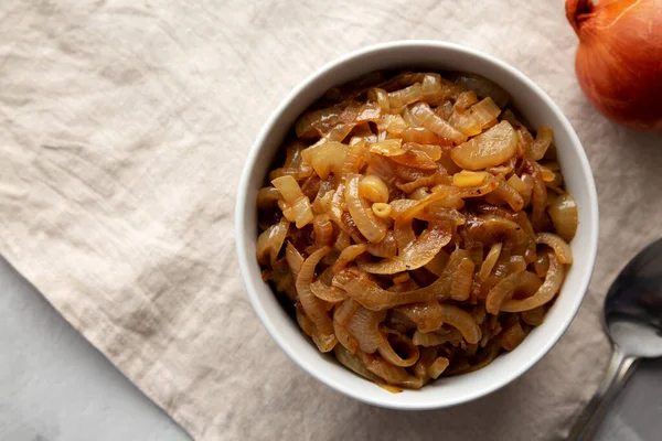 stock image Organic Caramelized Onions in a Bowl, top view. Flat lay, overhead, from above. Copy space.