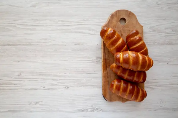 stock image Homemade Kolache Rolls on a rustic wooden board, top view. Overhead, from above. Copy space.