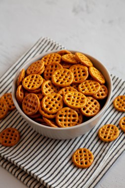 Organik Waffle Pretzels in a Bowl, side view. 