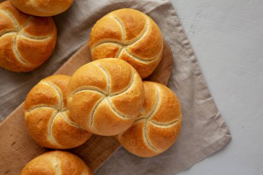 Homemade Kaiser Rolls on a wooden board, top view. Copy space. clipart