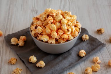 Homemade Crunchy Chicago-Style Popcorn with Caramel and Cheese in a Bowl, side view. clipart