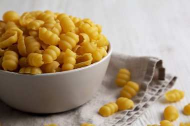 Homemade Dry Raw Gnocchi Pasta in a Bowl, low angle view.  clipart