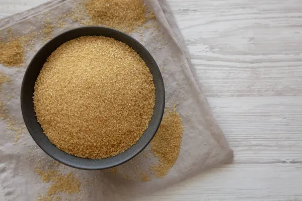 Organik Demerara Sugar in a Bowl, top view. Boşluğu kopyala.