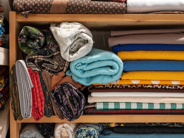 Folded Rolled Fabrics Wooden Shelves Drapery — Stock Photo, Image