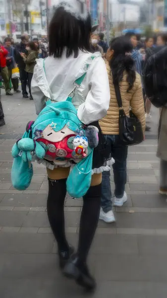 stock image Tokyo, Japan APRIL 2024 : blurred foto of a teenager wearing Lolita style clothes in the busy traffic of Tokyo