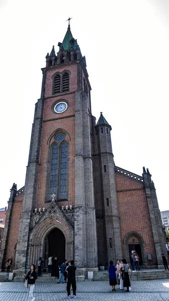 Stock image KOREA, SEOUL - April 2024: Myeong-dong Cathedral in Myeongdong. Myeongdong Cathedral is the Church for Archdiocese of Seoul and was also the birthplace for the Roman Catholic Church community in Korea.