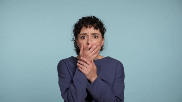 Portrait Beautiful Shocked Curly Woman Covers Mouth Palm Looking Camera — Stock Video