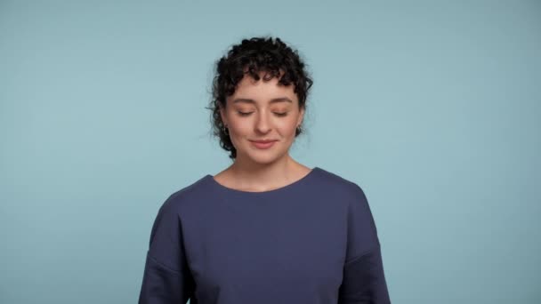 Close Smiling Curly Woman Blue Sweater Posing Looks Camera Winks — Αρχείο Βίντεο