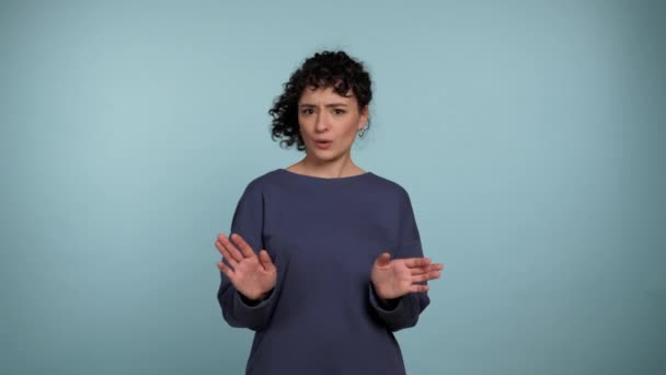 Portrait Curly Woman Need Distance Showing Stop Hands Gesture Looking — Vídeos de Stock