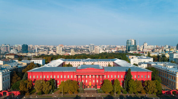 Aerial view building Kyiv National University of Taras Shevchenko on a sunny spring day. Drone shot red building facade. Capital of Ukraine