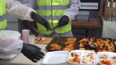 Volunteers distribute hot food. Food delivery services. Online food ordering. High quality 4k footage