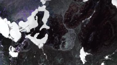 Black brown white liquid glitter dark magic background. Hypnotic surreal movement of shiny particles. High quality 4k footage