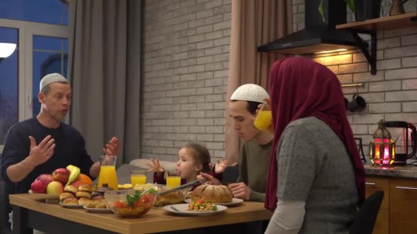 Happy Muslim Parents Having Evening Meal Kids Dining Table Home — Vídeo de Stock