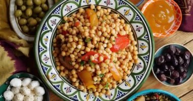 Chickpeas with vegetables and herbs. Traditional Middle Eastern cuisine. High quality 4k footage