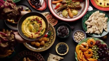 Fasting during Ramadan, iftar time. Authentic Middle Eastern local homemade meals in traditional dishes. High quality 4k footage